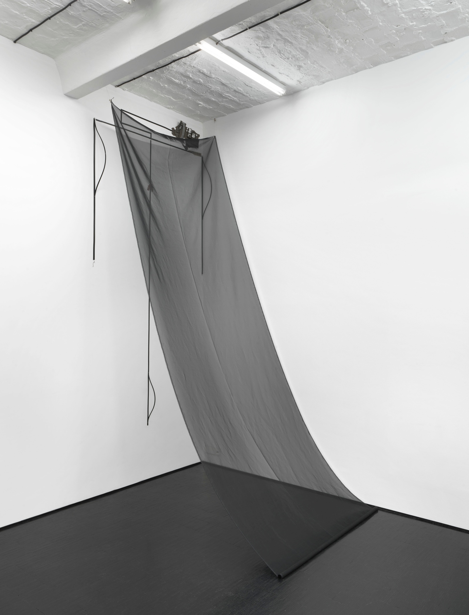 Gi, 2021. Electrical tape, thread, synthetic leather, acrylic, paper, chiffon, plastic, car bumper, aluminium, metal pipe. 370 x 140 x 205 cm